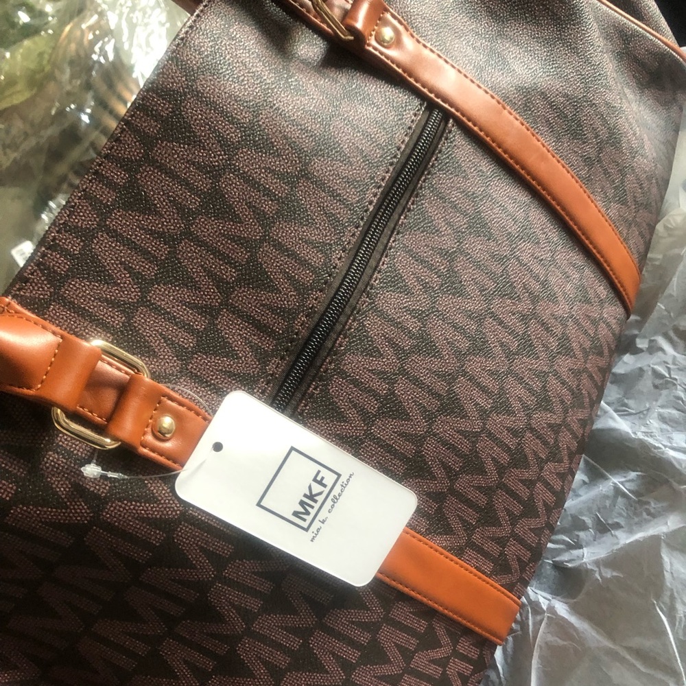 MK like bag is a carry on, on all your travels cross body strap included